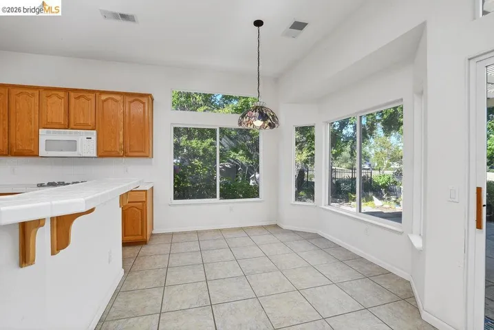 Kitchen area featuring tile flooring and a bay window