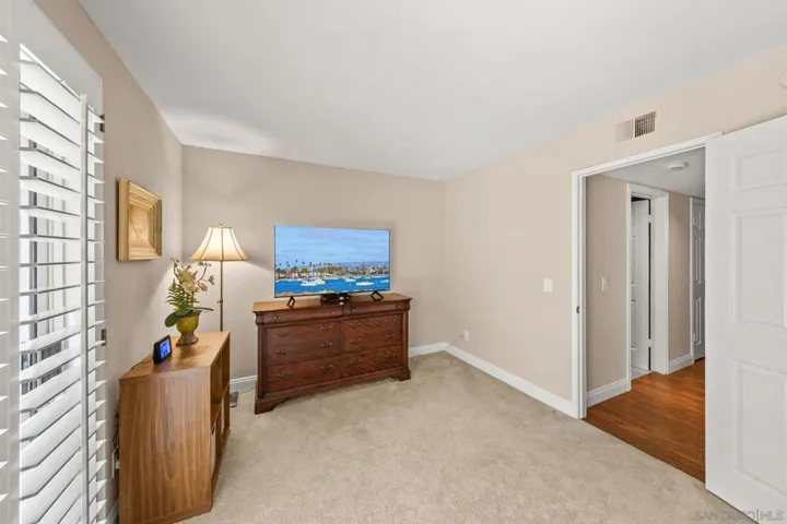 First floor bedroom with sliding door to a private patio