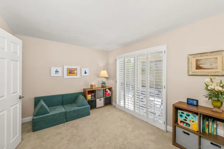 First floor bedroom with sliding door to private patio