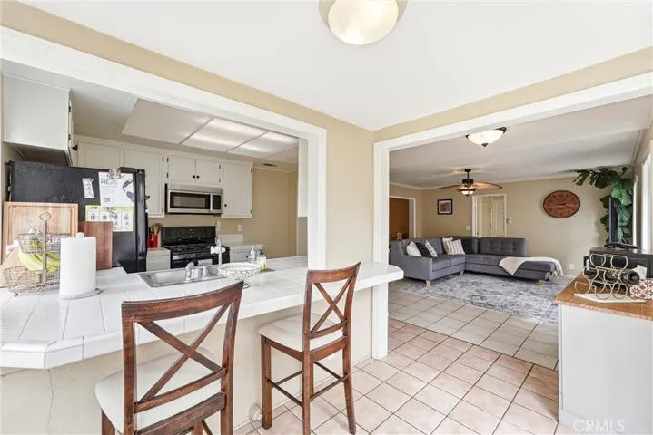 Kitchen breakfast bar with family room to the right