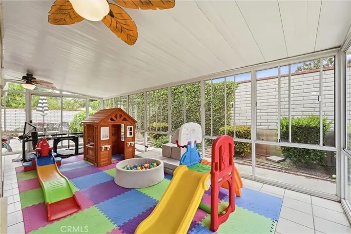 Sunroom being used as a playroom.