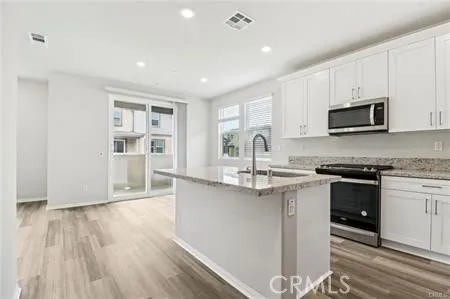 Vacant Picture Kitchen w/Gray Cabinets/Island