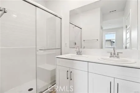 Primary Bathroom w Gray Vanity
