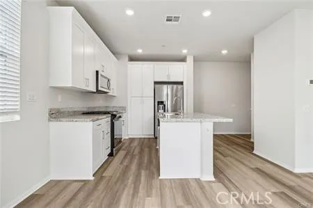 Vacant Picture Kitchen w/Gray Cabinets/Island