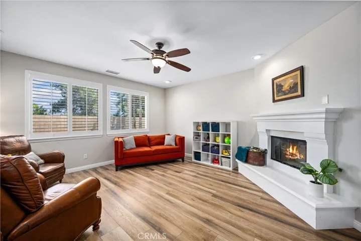Living room has natural lighting and gas fireplace