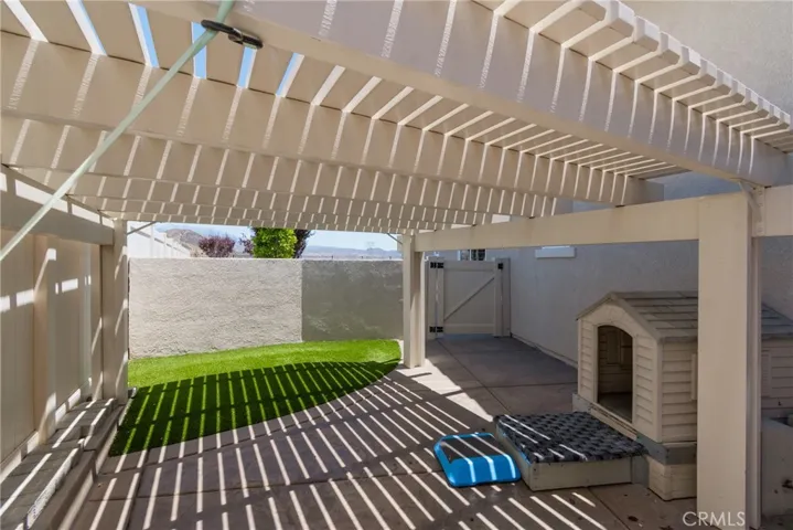 Custom Covered Contained Area for Pet with House & Turf - Accessed from Garage