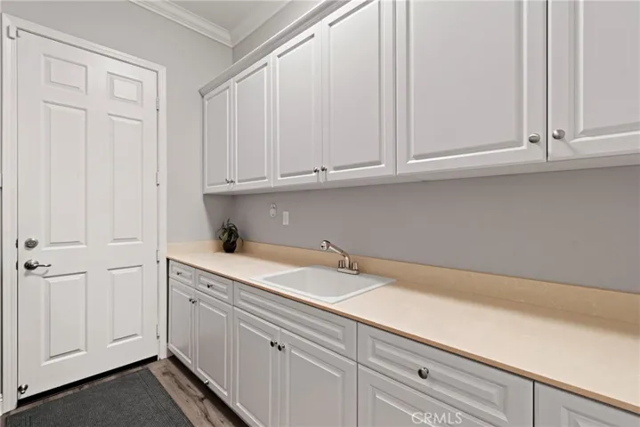 Laundry Room is Spacious with Lots of Storage & Utility Sink