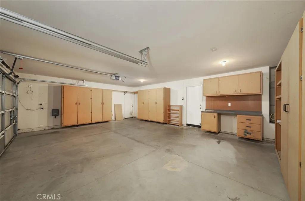 THREE CAR GARAGE!!!   Not many of these built anymore!!  ALL THE CABINETS TOO!!!