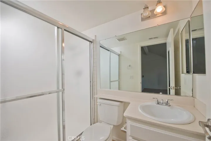 Upstairs full bathroom with closet.