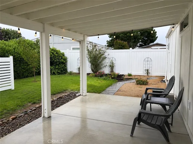Covered patio overlooking backyard