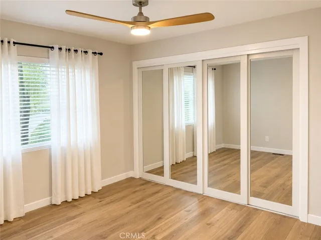 Guest Bedroom with mirrored closet doors