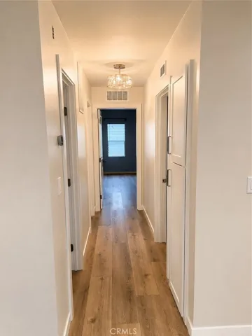 Hallway with built-in storage on right