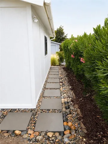 French drain and walkway down the right side of garage