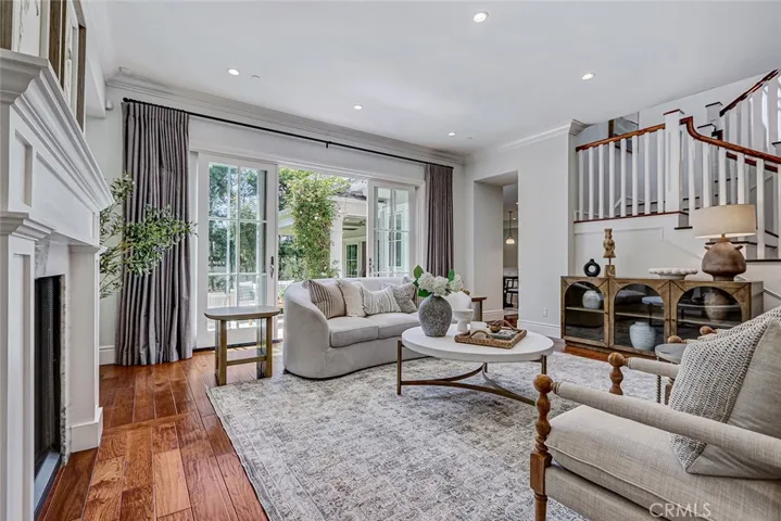 Formal Living Room Area with French Door Access to Backyard Patio Area