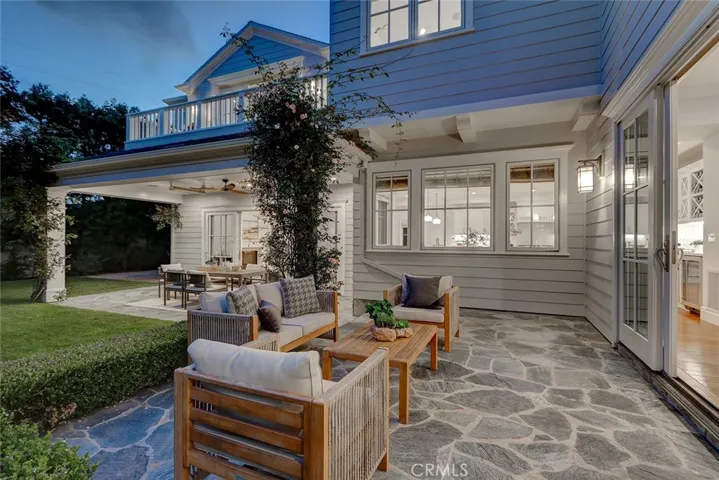 Evening Backyard Formal Living Room and Adjacent Family Room Patios
