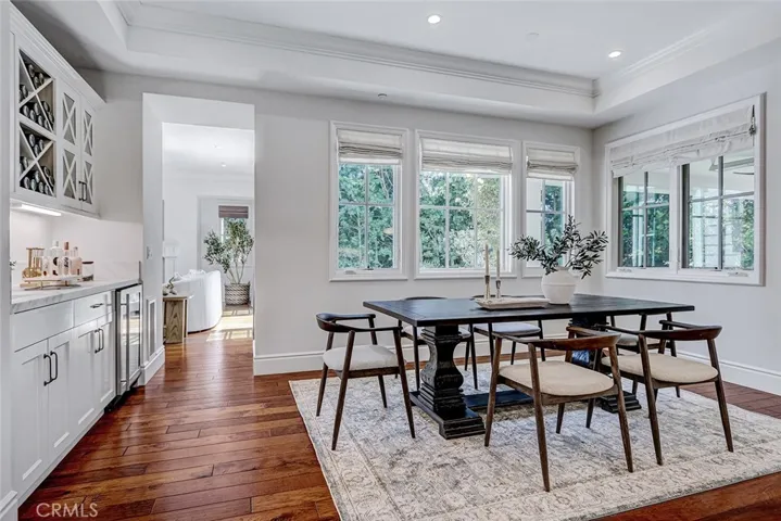 Breakfast Nook Area Adjacent to Wet Bar with View to Formal Living Room Area