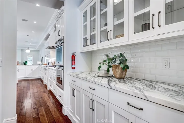 Butler's Pantry with Calacatta Marble Countertop and View to Kitchen