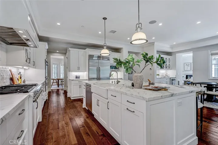 Kitchen Area with Calacatta Marble Countertops and Center Island