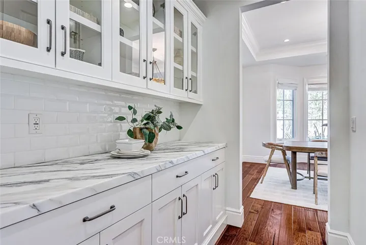 Butler's Pantry with Calacatta Marble Countertop and View to Formal Dining Room
