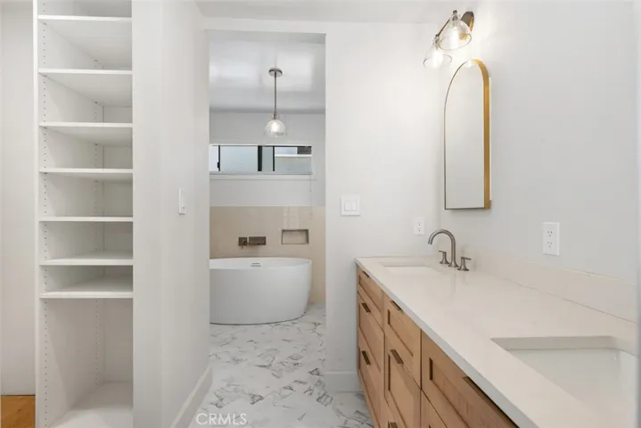 Designer, primary bathroom,  and custom closet.