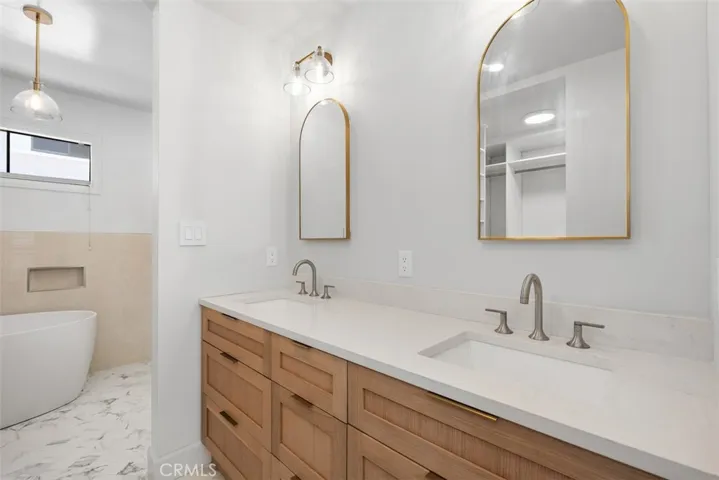 Dual vanities and stone countertops.