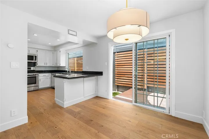 Dining room opens to kitchen and back deck and wrap around yard.
