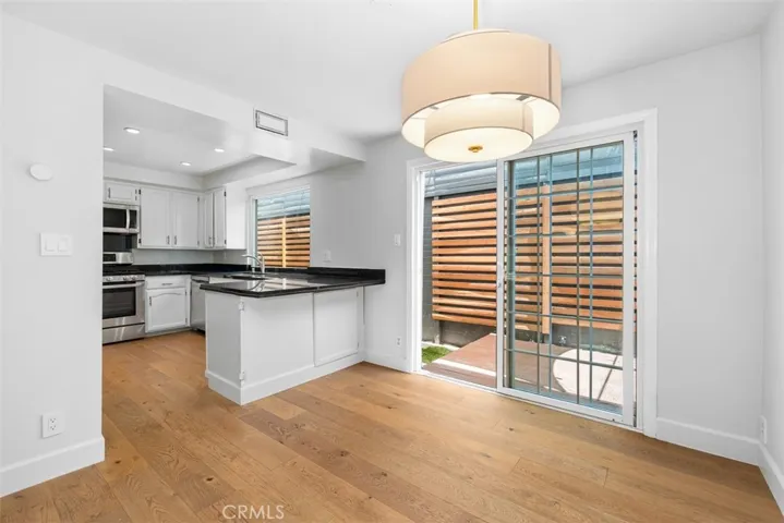 Dining room opens to kitchen and back deck and wrap around yard.