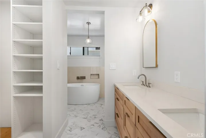 Designer, primary bathroom,  and custom closet.