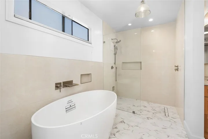 Brand new soaking tub, shower, and seamless glass enclosure.