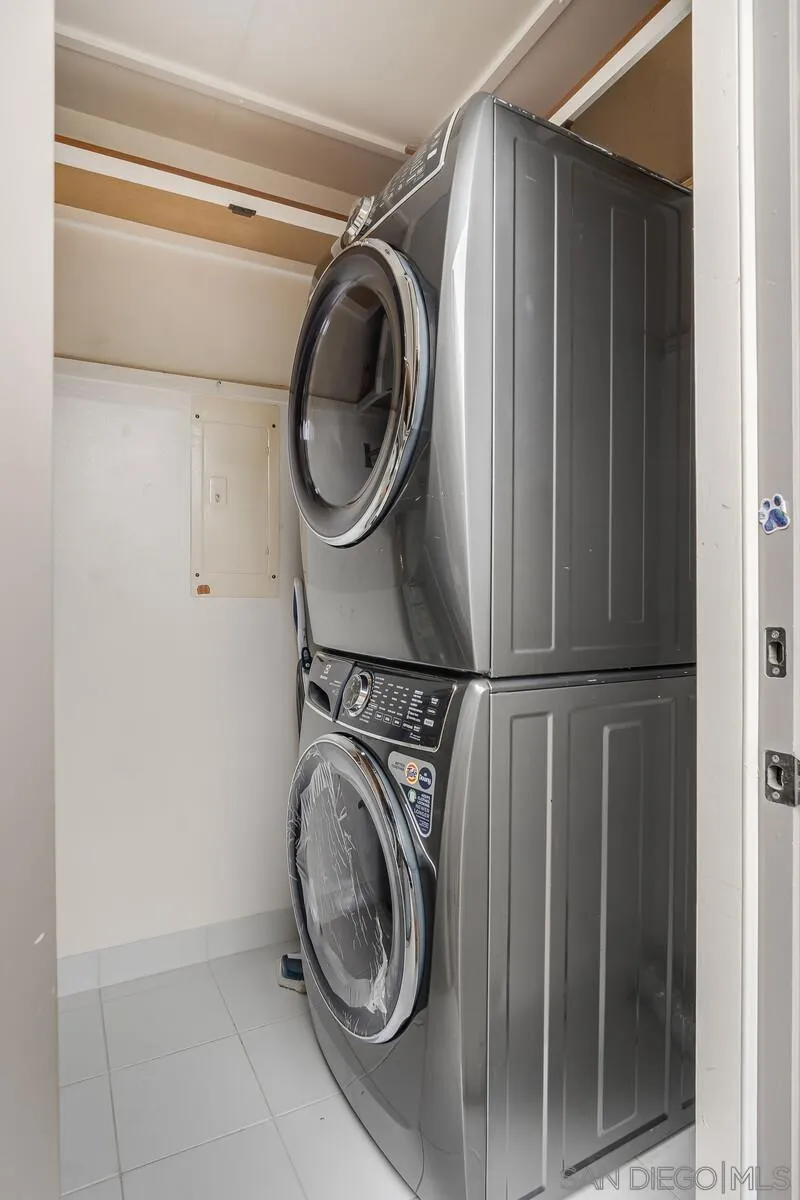 New Washer, Dryer and Bonus Refrigerator in this large utility room.