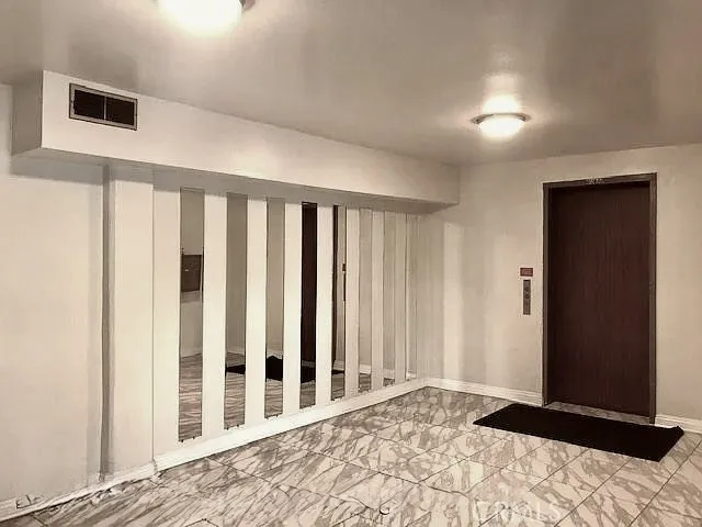 Lobby - ground level elevator to units upstairs Lobby - ground level elevator to units upstairs
