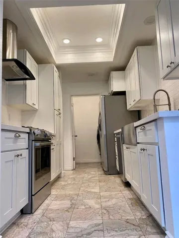 View from dining room through kitchen to laundry room