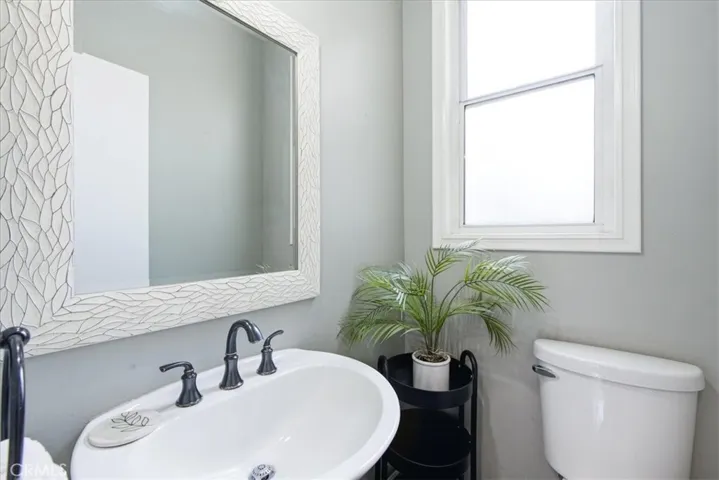 Bathroom with clean vanity and modern finishes