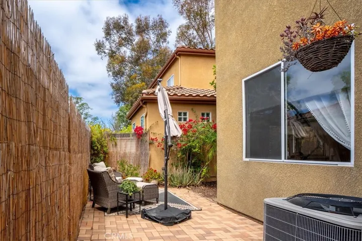 Private fenced outdoor area with seating and BBQ potential