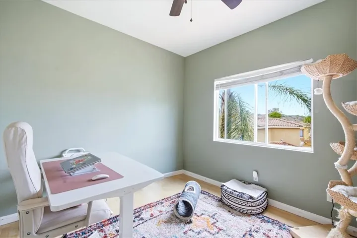 Flex/office space with natural light and work setup potential