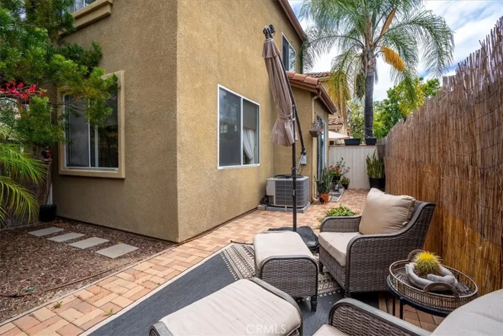 Side yard patio space with low-maintenance landscaping