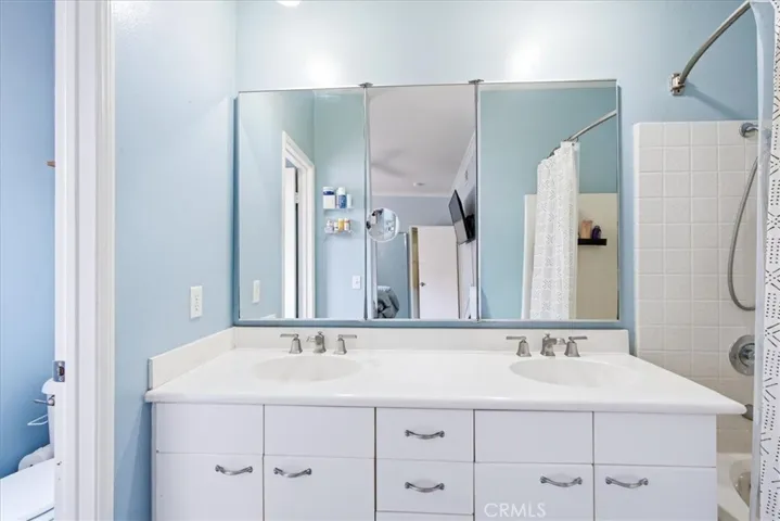 Updated bathroom with dual sinks and clean design