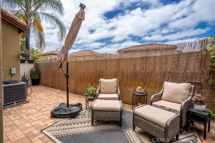 Spacious outdoor lounge area with multiple seating zones