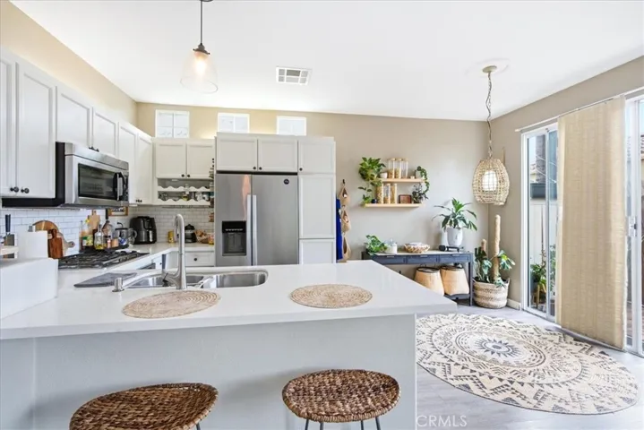 Kitchen overview featuring ample counter space and cabinetry