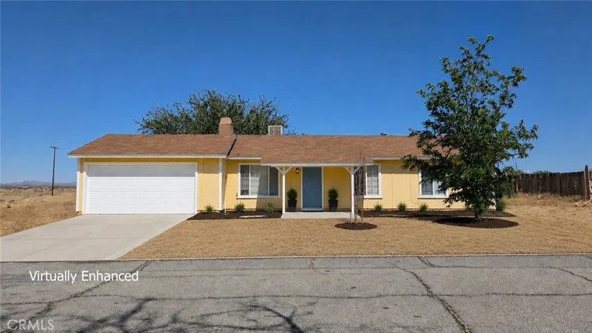 Virtually enhanced garage door and landscaping.