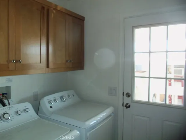 Laundry room including w/d and door leading to carport
