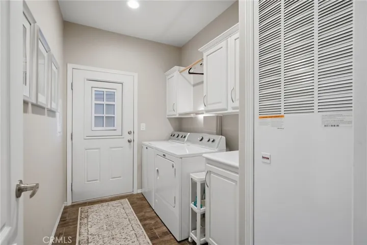 Laundry Room with Storage & Door to Garage
