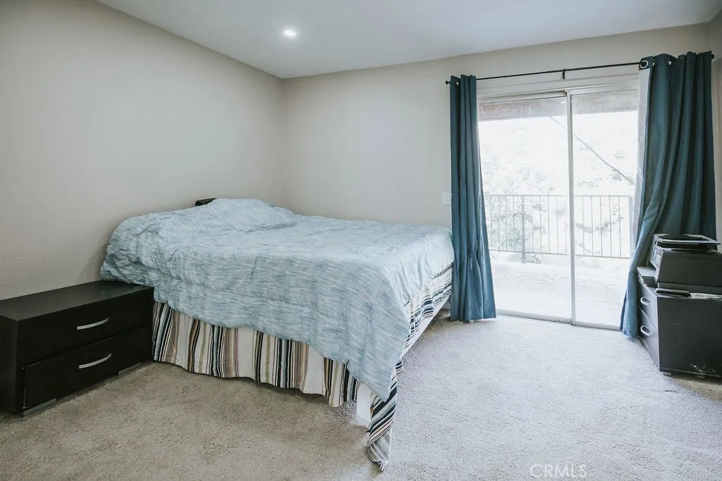 bedroom #1 with patio access