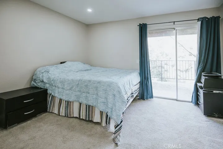 bedroom #1 with patio access