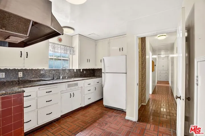 Kitchen with hallway to servic
