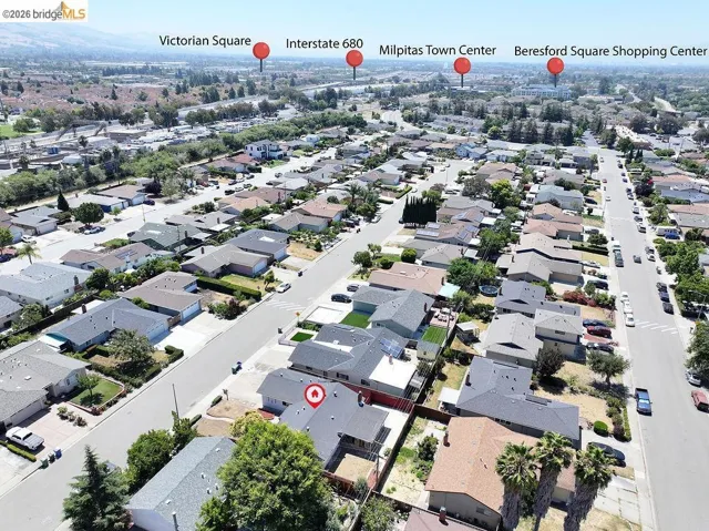 Aerial perspective showcasing a residential neighborhood with single-story homes
