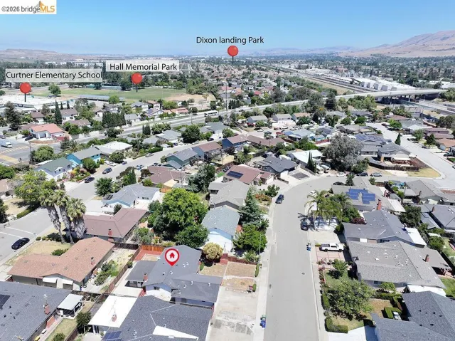 Aerial perspective showcasing a residential neighborhood with varied architectural styles and established landscaping
