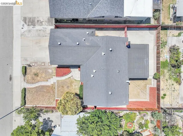Overhead view of a property featuring a dark gray asphalt shingle roof