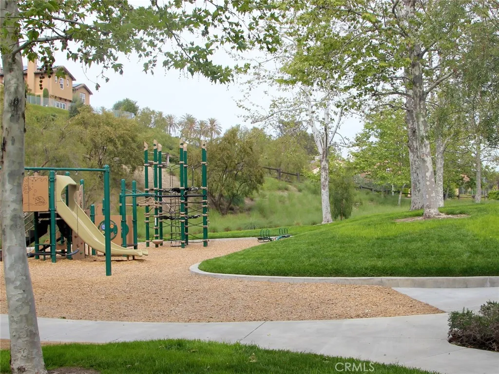 Community park with playground and open green space.