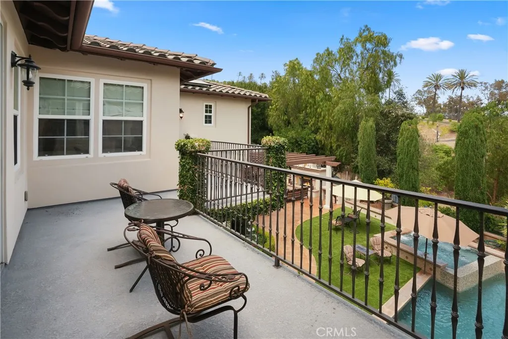 Enjoy tranquil views from the private balcony overlooking the resort-inspired backyard retreat. Image has been digitally enhanced.